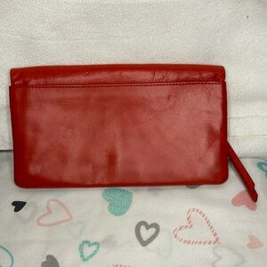HOBO INTERNATIONAL burnt orange genuine leather wallet. Holds up to 6 cards.